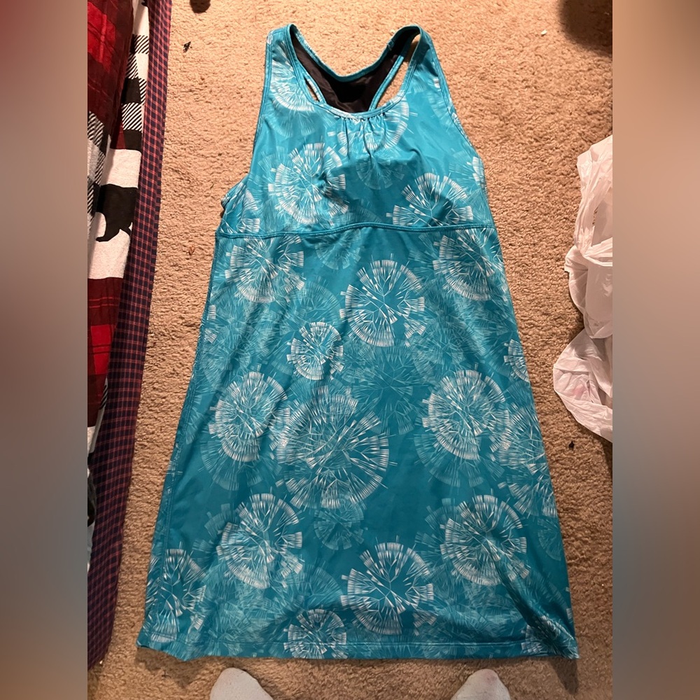 Skirt Sports Blue and White Sleeveless Dress has a pocket n the cleavage area.